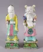 A PAIR OF 18TH / 19TH CENTURY CHINESE FAMILLE ROSE / VERTE FIGURES OF IMMORTAL FIGURES, both holding