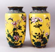 A PAIR OF JAPPANESE MEIJI PERIOD CLOISONNE VASES, with a yellow ground depicting birds in flight