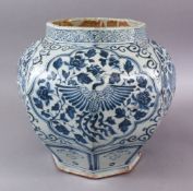 A CHINESE YUAN STYLE BLUE & WHITE OCTAGONAL PORCELAIN GINGER JAR, decorated with panels of phoenix