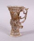 A CHINESE ROCK CRYSTAL STYLE PEKING GLASS CARVED CUP, carved with archaic style, with a best