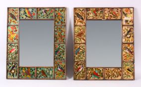 A PAIR OF PERSIAN PANELLED MIRRORS, with a central mirror section, with surrounding panels depicting