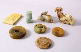 A MIXED LOT FO 8 CHINESE CARVED JADE PENDANTS / FIGURES, An erotic plaque, a monkey, three disks two