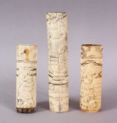 THREE 19TH CENTURY CHINESE CARVED IVORY SWORD / KNIFE HANDLES, each carved with various figures,