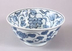 A 20TH CENTURY JAPANESE BLUE AND WHITE BOWL, with floral decoration, 15cm diameter.