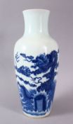 A CHINESE KANGXI STYLE BLUE & WHITE DRAGON PORCELAIN VASE, depicting dragons amongst waves and