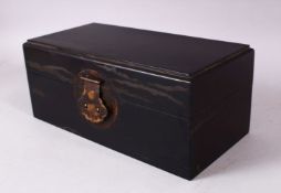 A CHINESE HARDWOOD RECTANGULAR HINGED BOX, 26cm long.