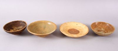 FOUR EARLY CHINESE POTTERY BOWLS, 13.5cm down to 11cm.
