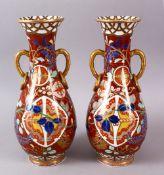 A PAIR OF JAPANESE KUTANI TWIN HANDLE VASES, with geometric and floral decoration, with twin