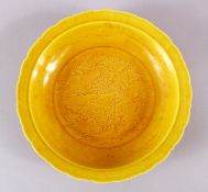 A CHINESE YELLOW INCISED PORCELAIN DRAGON DISH, decorated with an imperial dragon central, the