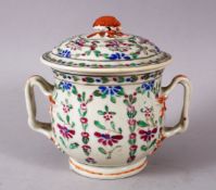 A CHINESE FAMILLE ROSE PORCELAIN CUP & COVER, with twin moulded handles and a floral finial, 13cm
