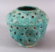 A KASHAN TURQUOISE POTTERY OPENWORK VASE, the body with openwork sections, 15cm high