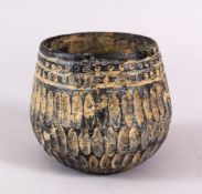 A EARLY SYRIAN MOULDED GLASS VASE, 9cm high.