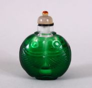 A GOOD 19TH CENTURY CHINESE PEKING GLASS TWIN FISH SNUFF BOTTLE, the bottle in green glass made up
