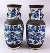 A LARGE PAIR OF CHINESE BLUE & WHITE CRACKLE GLAZED VASES, with dragon decoration to the body with