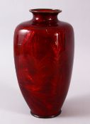 A JAPANESE MEIJI PERIOD BASSE TAILLE CLOISONNE VASE BY KUMENO TEITARO, the red glaxe over decoration
