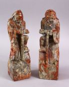 A PAIR OF CHINESE CARVED SOAPSTONE FIGURES OF DEMONS, each demon depicted upon a rocky outcrop