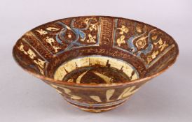 A GOOD IRAN STYLE POTTERY BOWL, decorated with blue & brown glaze in formal style of motif, 24.
