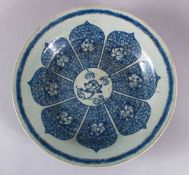 A CHINESE REPUBLIC STYLE BLUE & WHITE PORCELAIN DISH, decorated with eight lotus and petals, 27cm.