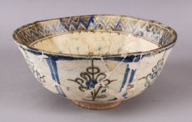 AN ISLAMIC POTTERY GORGAN BOWL, decorated interior with motif decoration, 22cm (af)