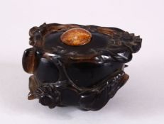 A CHINESE CARVED DARK CRYSTAL / QUARTZ FLORAL POT & COVER, the body carved with flora and stood upon