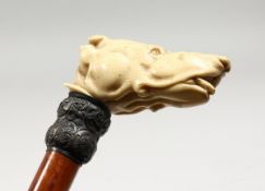 A VICTORIAN UMBRELLA with carved ivory dog handle, Engraved Charles Clark, Haywards Heath.