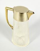A CUT GLASS RIBBED AND TAPERING CLARET JUG with plain plated mounts. 9.5ins high