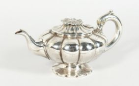 AN EARLY VICTORIAN SILVER SHAPED TEAPOT with flower finial. London 1840. Maker I.J. Keith, weighs