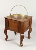 A CONTINENTAL SQUARE SHAPED OVAL JARDINIERE with brass liner 14 ins wide x 1 ins high.