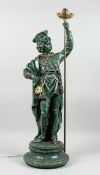 A COMPOSITION STANDING FIGURE OF A NOBLEMAN HOLDING A TORCH, 2 ft. 11 in. high.
