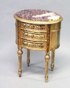 A FRENCH STYLE GILT WOOD THREE DRAWER OVAL CHEST, with red marble inset top.