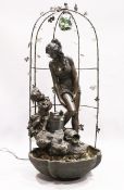 A FINE BRONZED WATER FEATURE, a classical female and Cupid standing on a metal base and arbour.