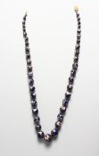 A CLOISONNE ENAMEL BEAD NECKLACE with gold clasp, 24 inches long.