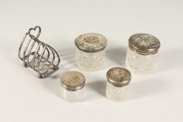A HEART SHAPED TOAST RACK, FOUR PIN BOTTLES, 2 with silver tops (5).