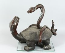 A BRONZE TURTLE being attacked by a snake 18 ins high.