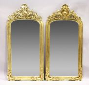 A PAIR OF GILT RECTANGULAR UPRIGHT MIRRORS with scroll decoration, 6 feet 2 inches high x 3 feet
