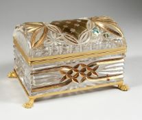A CUT GLASS AND GILDED CASKET with domed top on clawed feet, 7 in. wide.