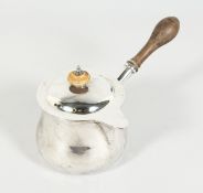A GEORGE III SILVER BRANDY PAN and cover with wooden finial and handle. London 1812 & 1810, gross