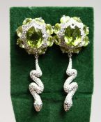 A PAIR OF SILVER PERIDOT SNAKE EARRINGS
