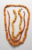 THREE AMBER NECKLACES.