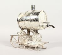 A PLATED RUSSIAN BEAR carrying a barrel on a sleigh