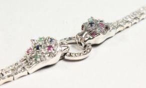 A SAPPHIRE, RUBY AND EMERALD SILVER BRACELET