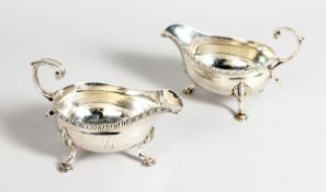 A PAIR OF GEORGE III SILVER SAUCE BOATS, with rope edge on pad feet Lonon 1763, maker Doud &