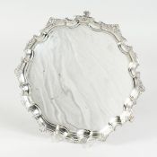 A GOLDSMITH AND SILVERSMITHS CO. PIE CRUST SALVER, 12 ins wide cast rim on knurled feet, London