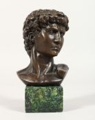 AFTER THE ANTIQUE, A bronze bust on a marble plinth. 6 ins high