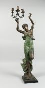 A CLASSICAL BRONZE FEMALE holding three scrolling candle branches on a square base, 2 ft. 8 in.