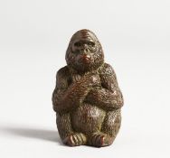 A SMALL JAPANESE BRONZE GORILLA, 1.75 ins high