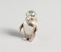 A SILVER PENGUIN PIN CUSHION