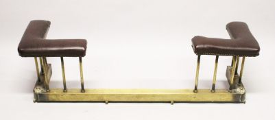 A BRASS AND RED LEATHER, CLOTH UPHOLSTERED CLUB FENDER 4 ft. 4 ins. long, 1 ft. 2ins deep, 1 ft. 4