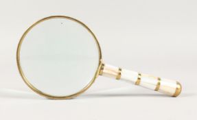 A MOTHER OF PEARL HANDLED MAGNIFYING GLASS