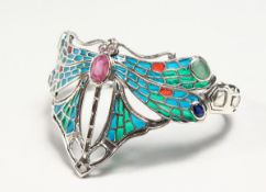 A SILVER RUBY EMERALD SAPPHIRE AND ENAMEL DRAGONFLY BANGLE